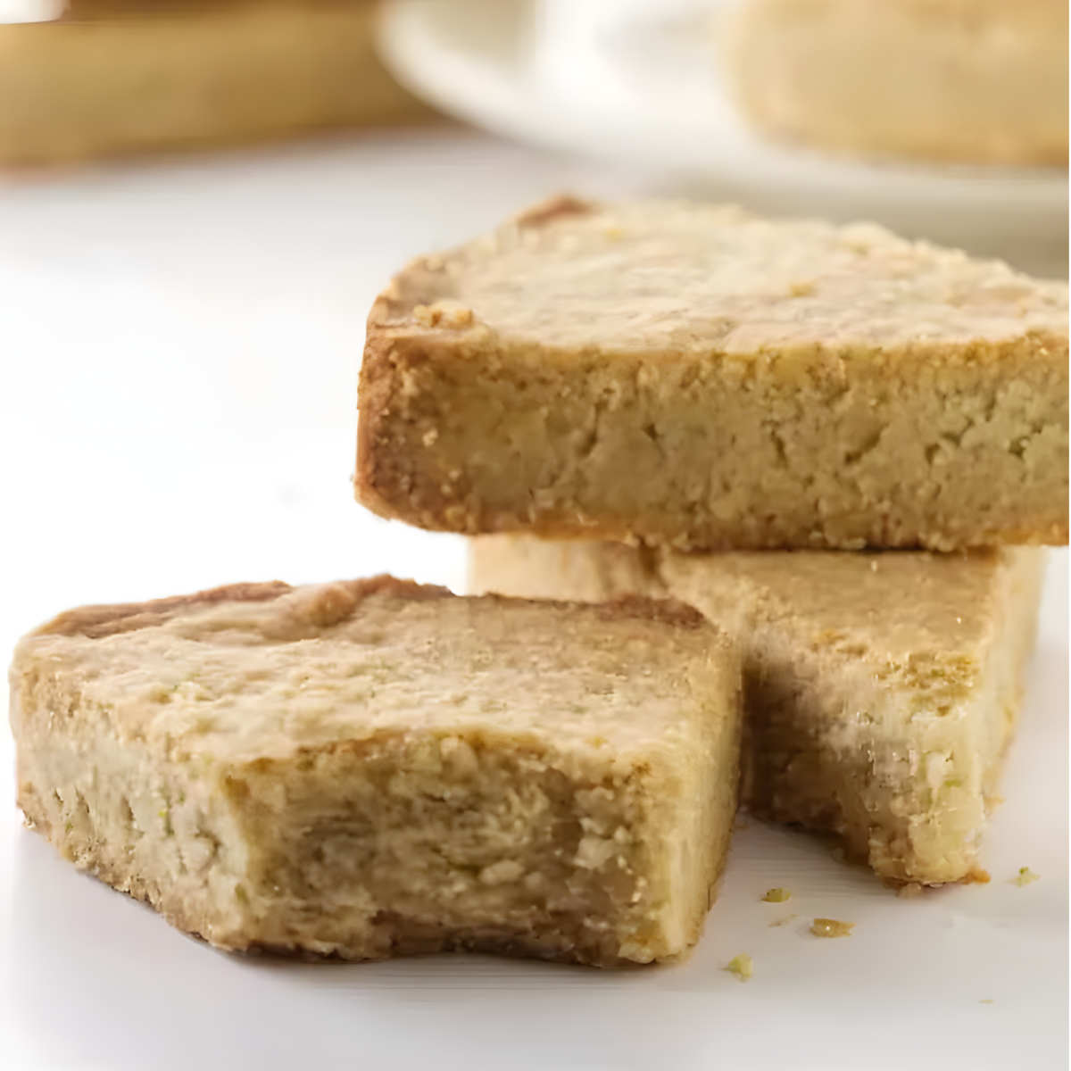 Several oat flour shortbread cookies stacked on top of each other.