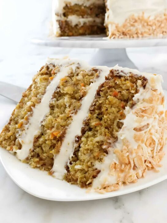 A slice of pineapple carrot cake with three layers.