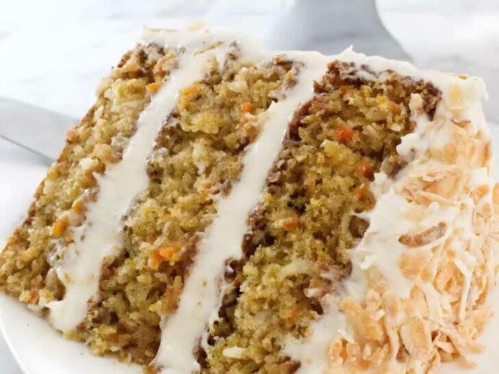 A slice of pineapple carrot cake with three layers.