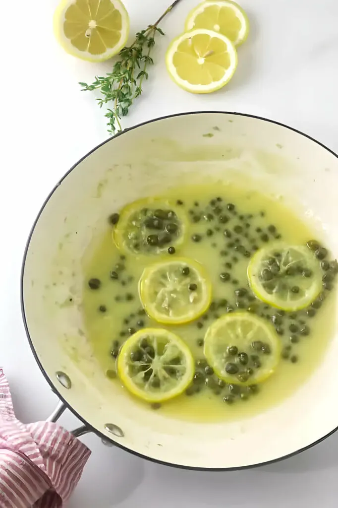 Making lemon piccata sauce in a pan.