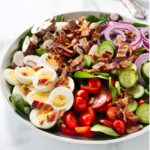 A classic spinach salad with bacon and crisp veggies.