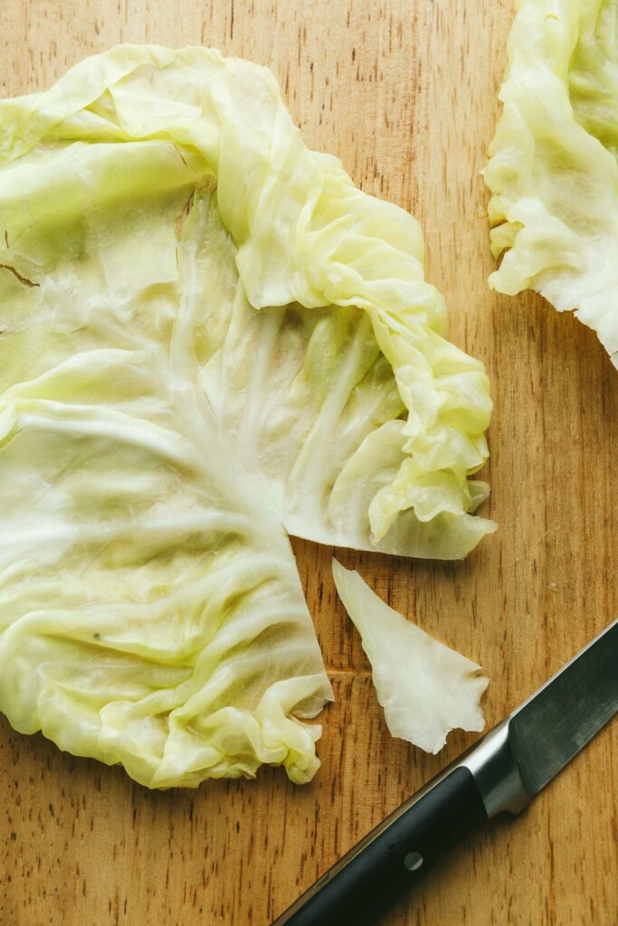 Prepping a cabbage leaf for making cabbage rolls.