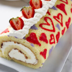 A valentine cake roll with a heart pattern baked into the sponge.