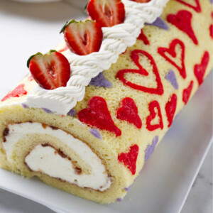 A valentine cake roll with a heart pattern baked into the sponge.