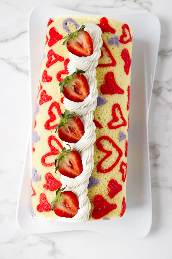 A cake roll with a heart pattern baked into the sponge cake.