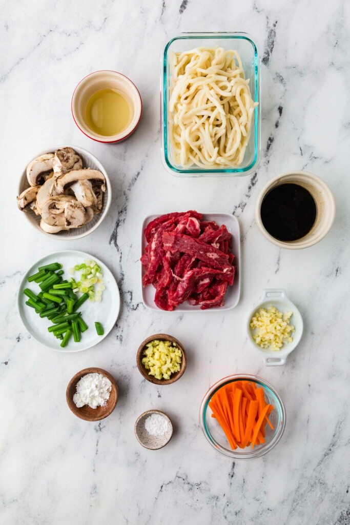 Udon noodles, beef, stir fry sauce, ginger, garlic, scallions, carrots, mushrooms, baking soda, corn starch.