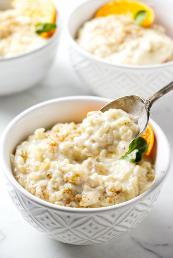 A spoon scooping some homemade rice pudding.