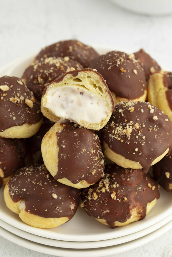 A plate filled with mini ferrero rocher cream puffs.