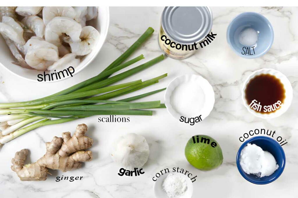 Labeled shrimp and cooking ingredients arranged on a marble countertop.