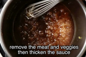 Metal whisk stirring bubbling brown sauce in pot; instructional text overlay.