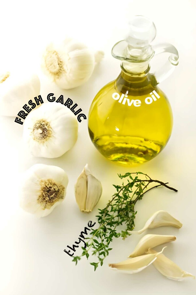 Olive oil bottle, garlic bulbs, cloves, and thyme sprig with labels.