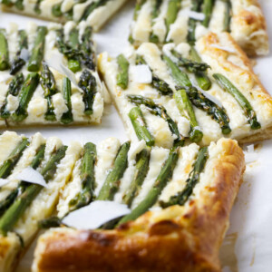 A freshly baked asparagus and puff pastry topped with parmesan.
