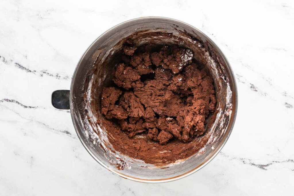 Beating in the powdered sugar to make chocolate buttercream.