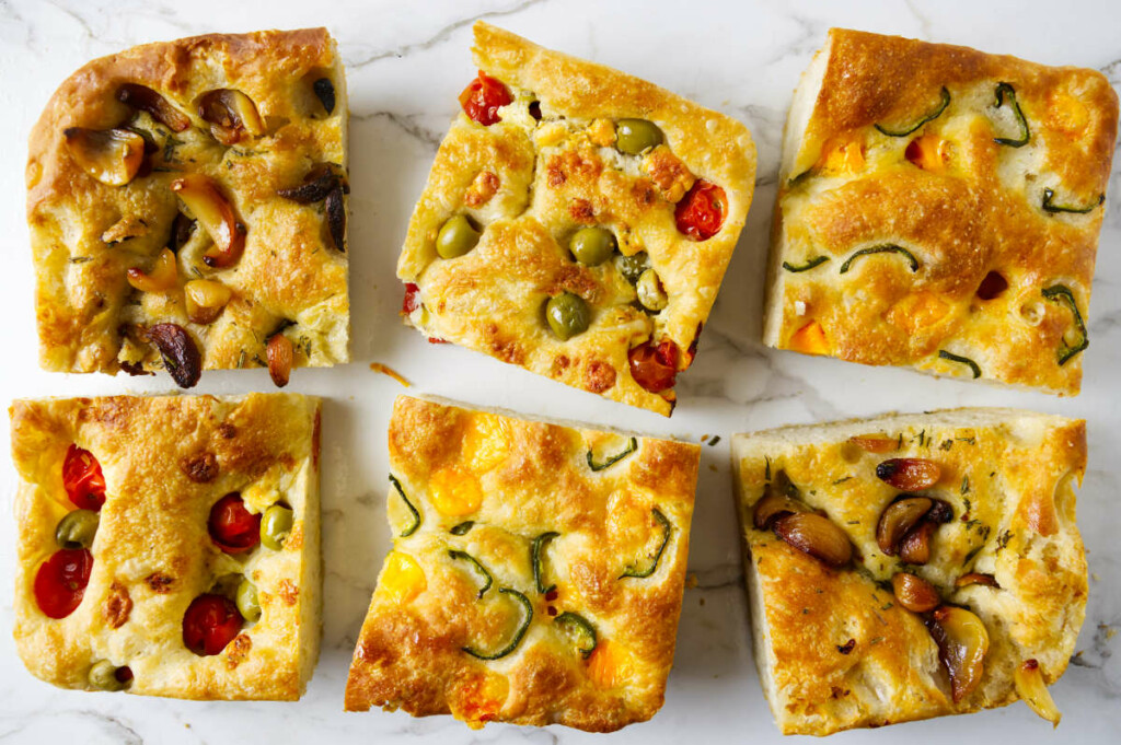 Sourdough focaccia topped with savory toppings.