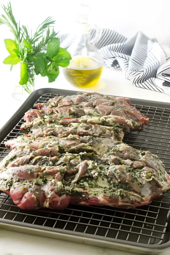 A butterflied leg of lamb with marinade. 