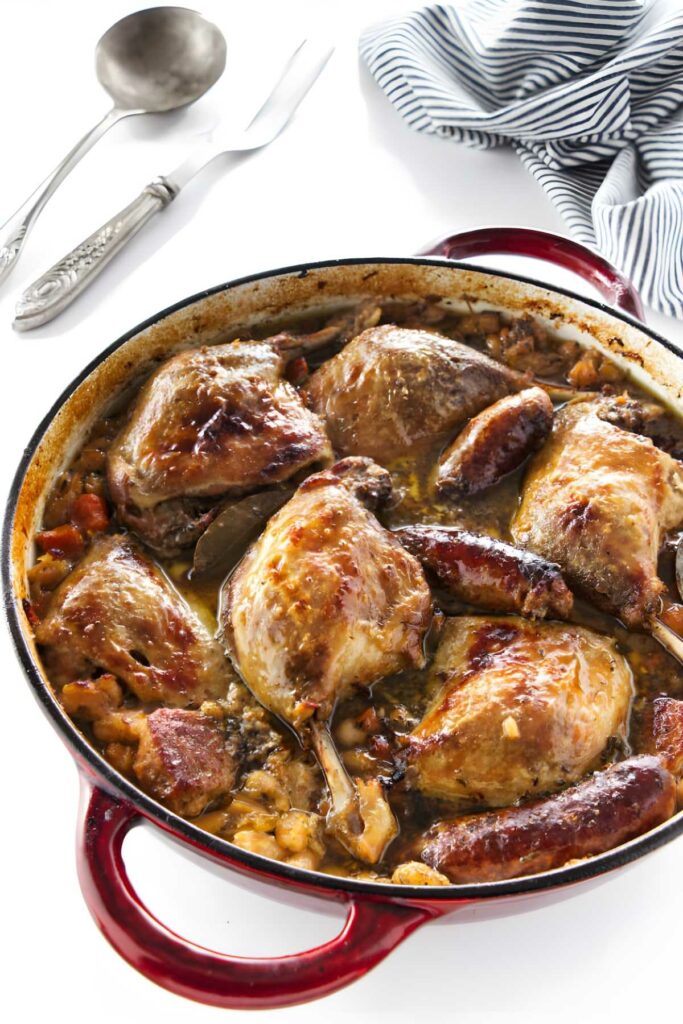 Duck, sausage and beans in a Dutch oven.