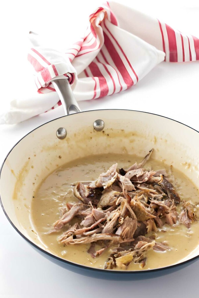 Shredded duck meat in creamy sauce.