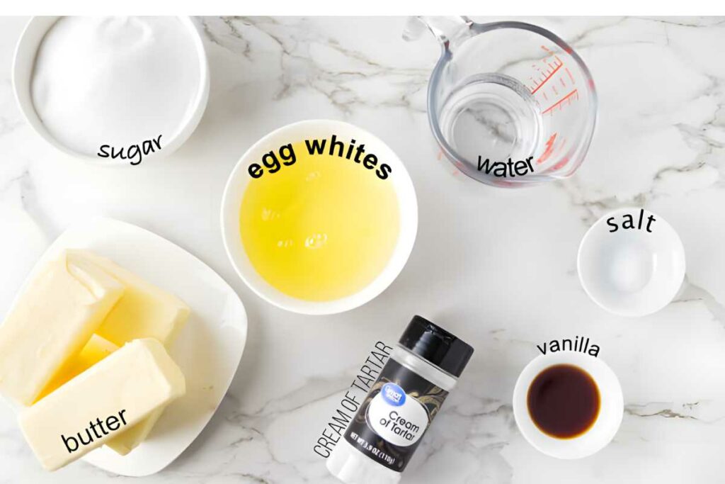 Overhead view of labeled baking ingredients arranged on a marble surface.