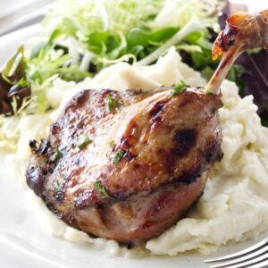 Sous vide duck leg on mashed potatoes with herbs.