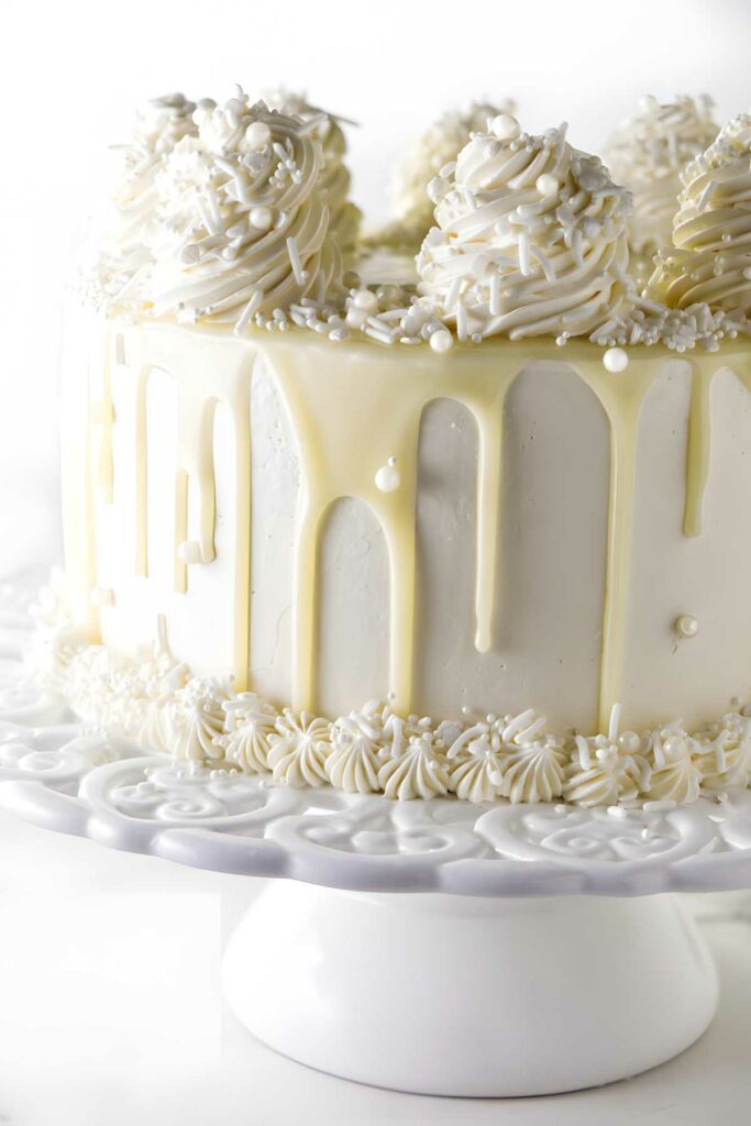 White chocolate cake with white chocolate drip.