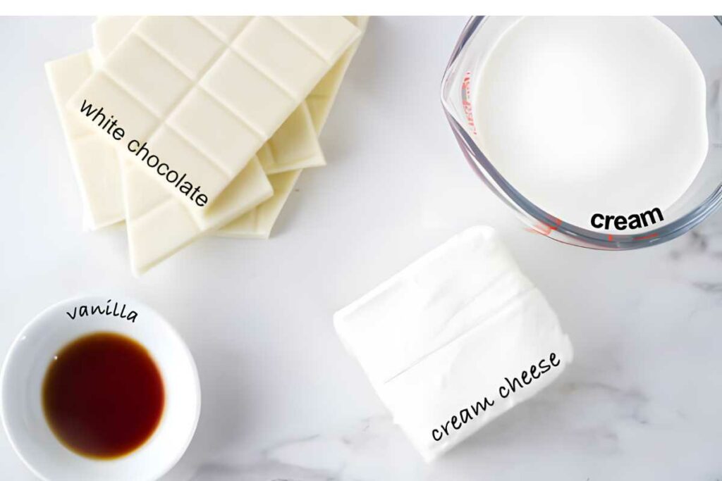 Overhead view: white chocolate, cream, vanilla extract, and cream cheese labeled.