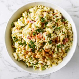 A bowl filled with a macaroni salad recipe.
