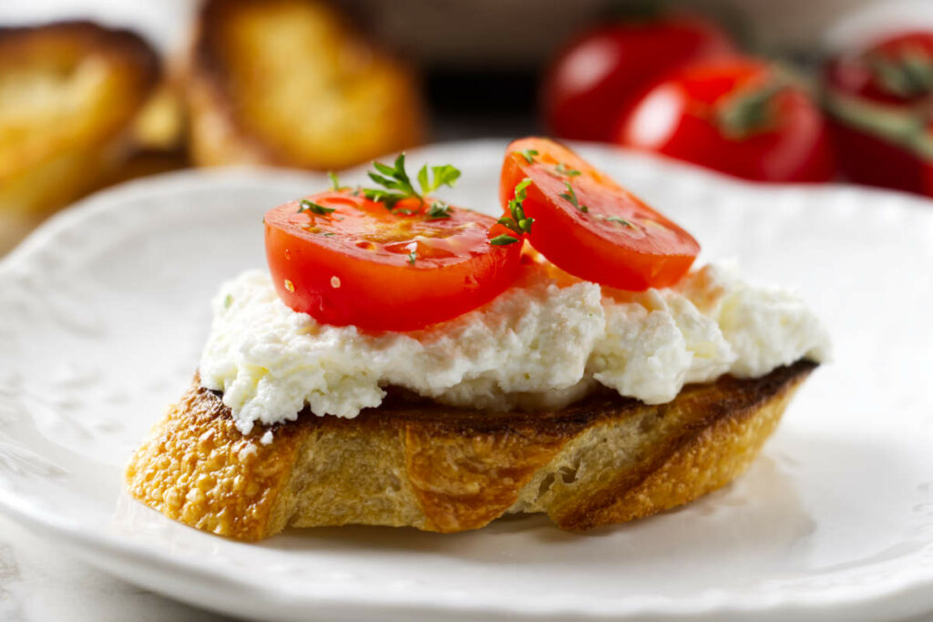 Toasted bread topped with homemade ricotta cheese.