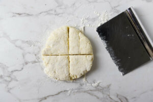 Slicing the dough in quarters.