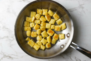 pan-seared gnocchi cooked until golden brown with crispy edges.