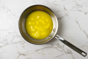 Partially melted butter in a pan.