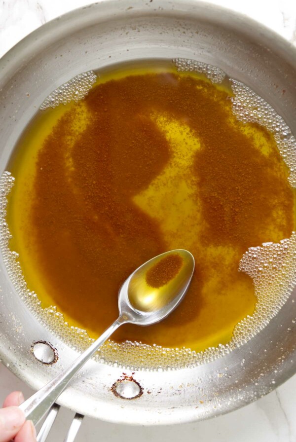 A skillet with toasted browned butter.