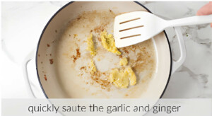 Sautéing garlic and ginger in a skillet.