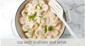 Topping coconut sauce shrimp with scallions.
