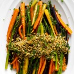 A carrot asparagus recipe with a panko and sunflower seed topping.