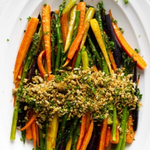 A carrot asparagus recipe with a panko and sunflower seed topping.