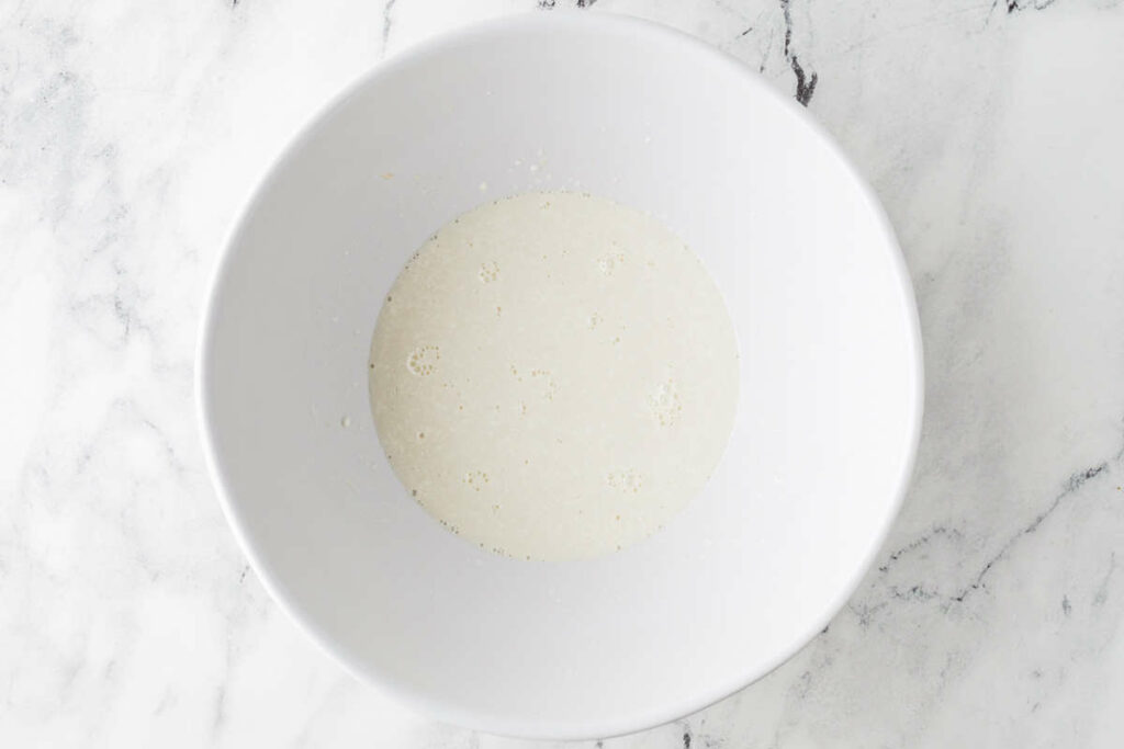 combining sourdough discard with milk and sour cream.