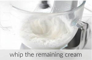 Whipping cream in a mixing bowl.