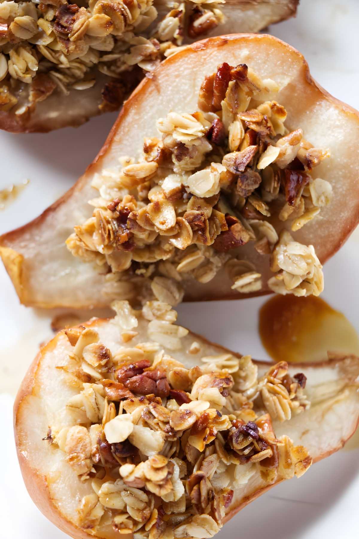 Close-up of baked pear halves filled with granola.