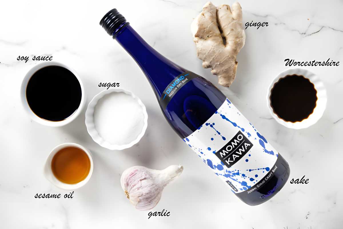 Momo Kawa sake bottle surrounded by labeled Asian sauces and seasonings.