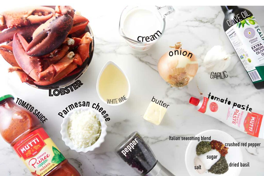Overhead view of lobster and sauce ingredients arranged in bowls and plates.