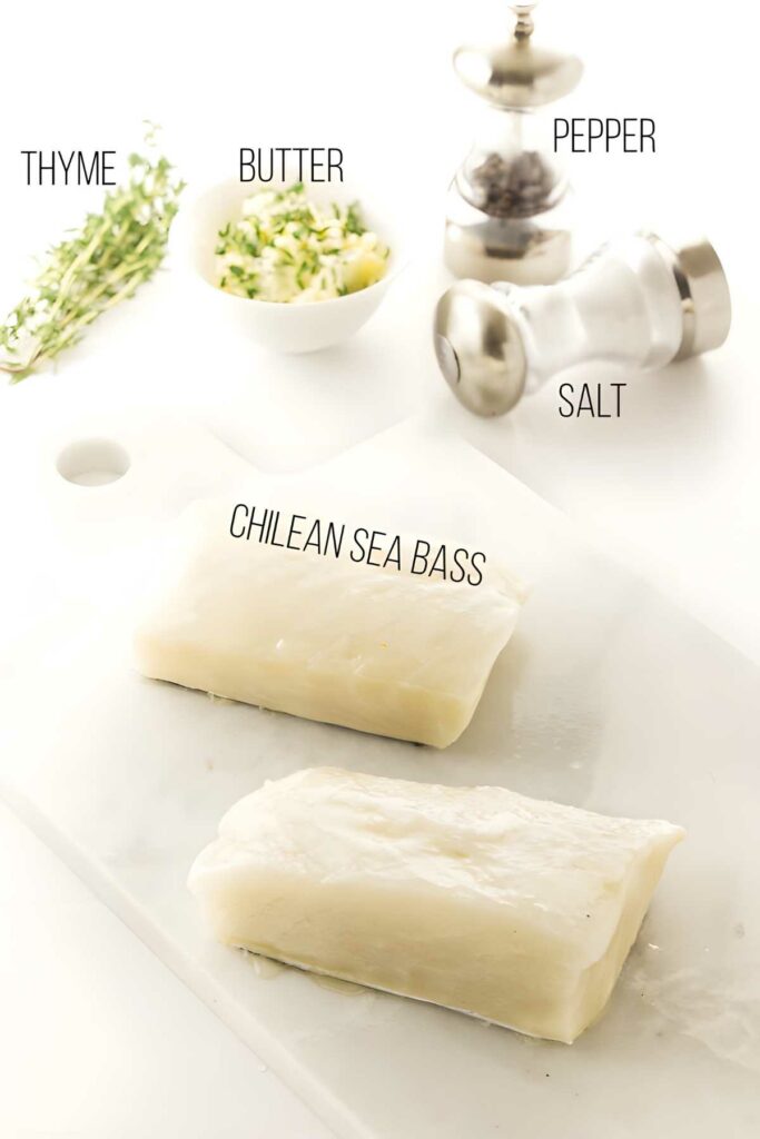 Two raw Chilean sea bass fillets with butter, thyme, salt, and pepper.