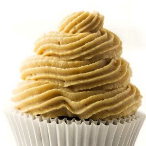 Close-up of cupcake with peanut butter cream cheese frosting.