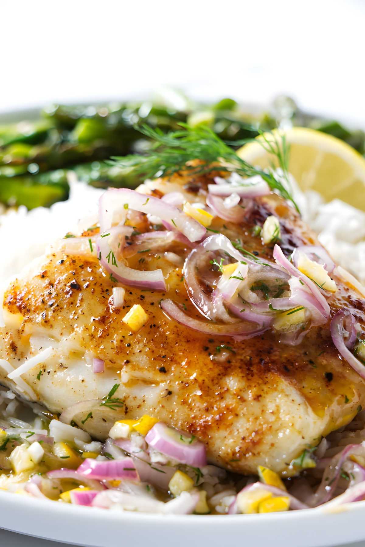 Pellet grill sea bass with lemon sauce on top.