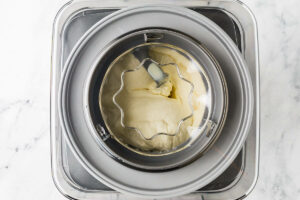 Vanilla ice cream in an ice cream churner.