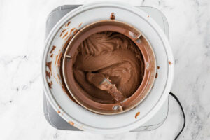 Chocolate ice cream in an ice cream maker.