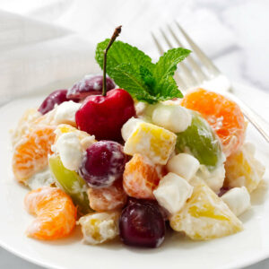 A serving of ambrosia salad made with fresh fruit.
