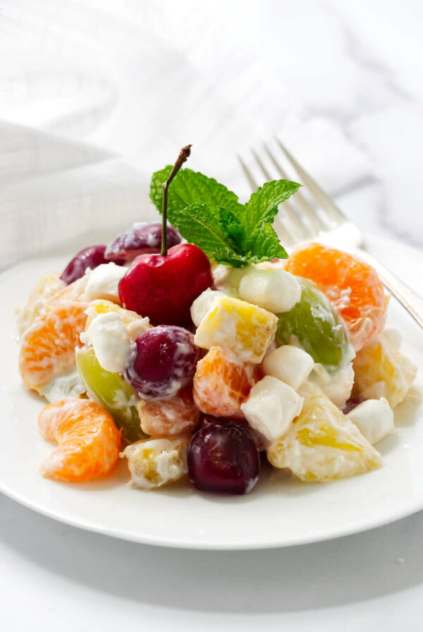 A serving of ambrosia salad made with fresh fruit.