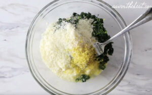 Blending cheese into the dough for a recipe for italian dumplings.