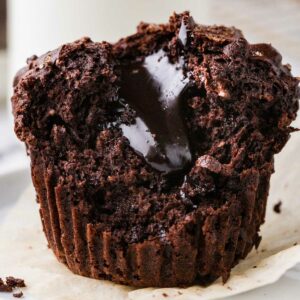 A molten chocolate muffins with fudge in the center.