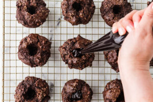 Piping chocolate filling into viral olympic chocolate muffins.
